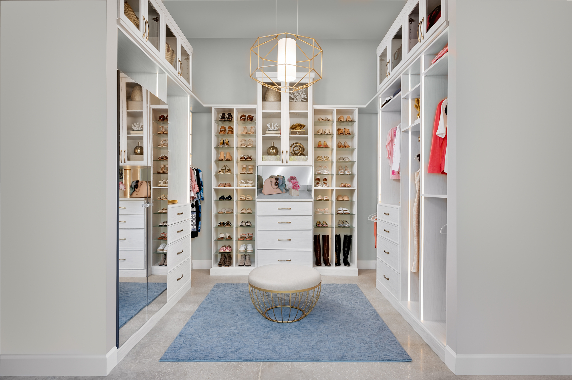 Custom boutique closet in houghton with shoe shrine shelving and mirror doors