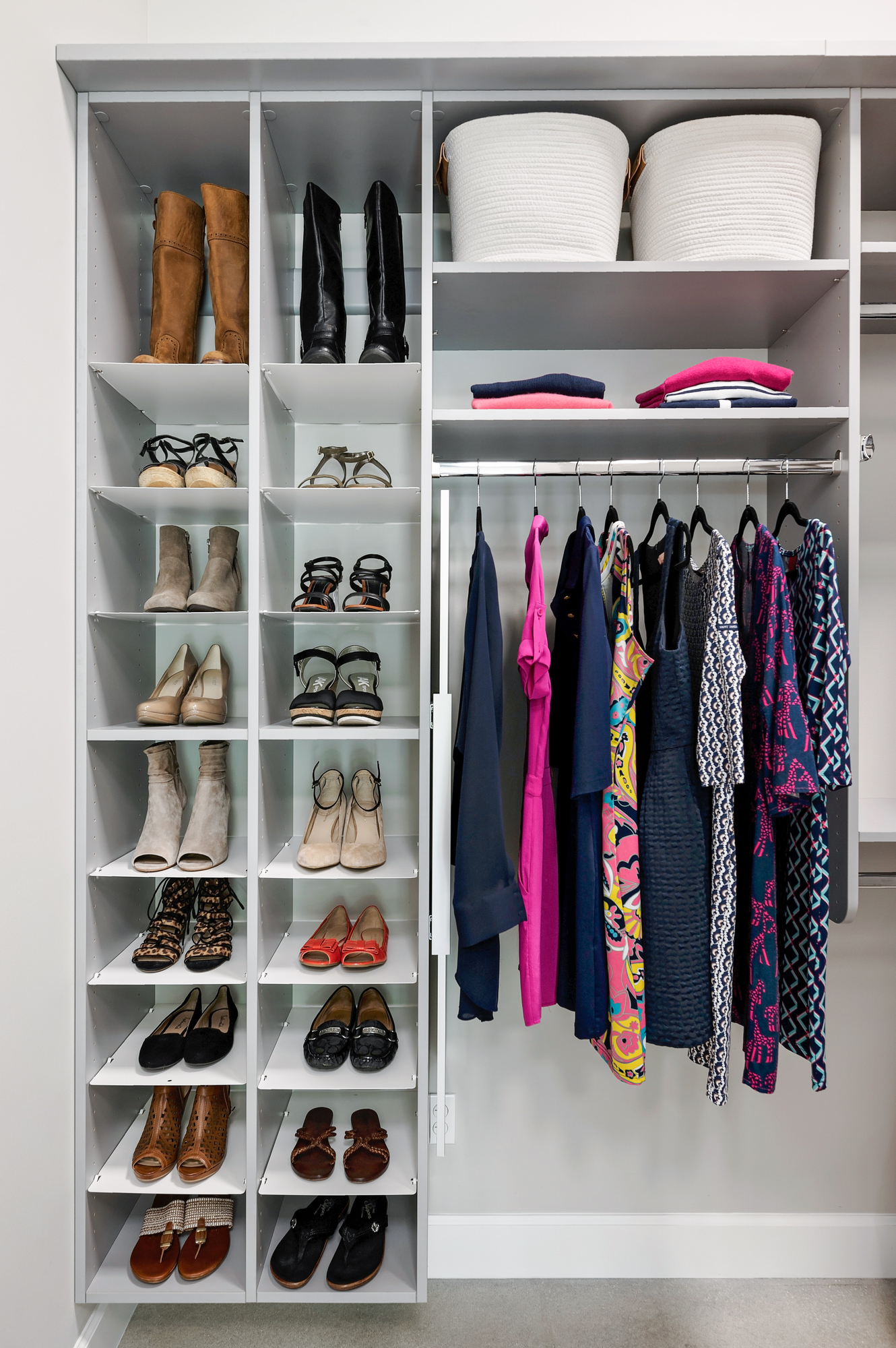 Customgreywalk inclosetwithadjustableshoeorganizerandhangingrodsinVeroBeach,Florida